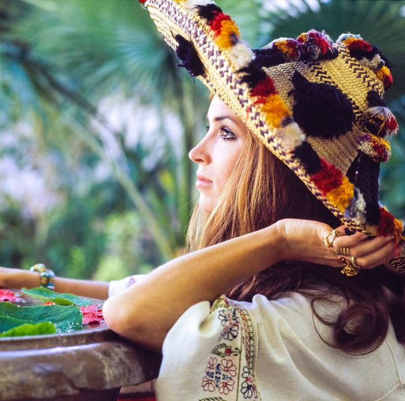 #16 Talitha Getty wearing a sombrero in a garden in Marrakesh, Morocco, January 15, 1970