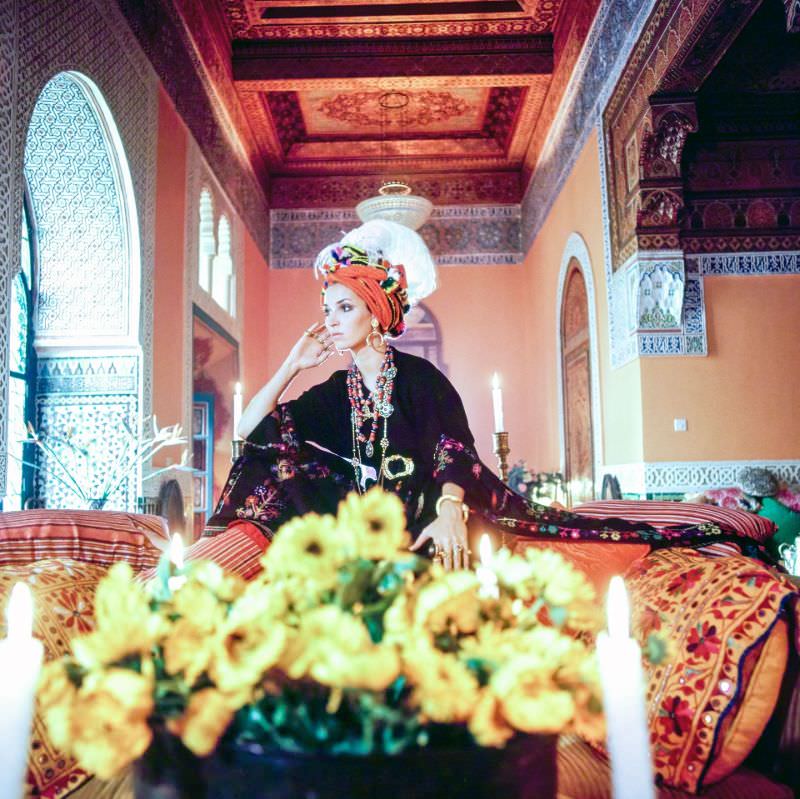 #17 Talitha Getty wearing a turban and kaftan in her living room in Marrakesh, Morocco, January 15, 1970