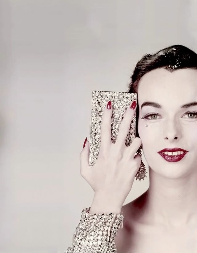 #16 Victoria von Hagen with minaudière by Evans, bracelet from Henri Bendel, earrings by Ledo, Vogue US, October 15, 1952
