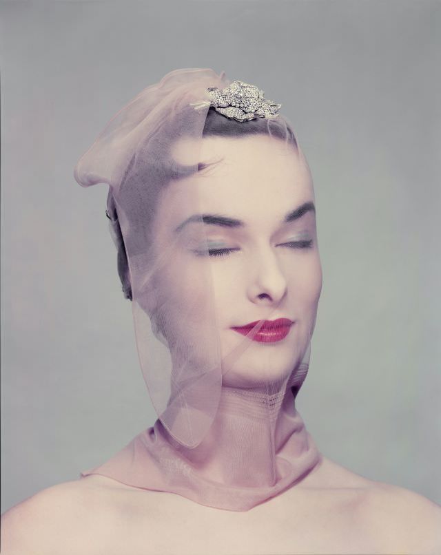 #29 Victoria von Hagen wearing rose diamond brooch by Van Cleef & Arpels, Hudson nylons, April 1954