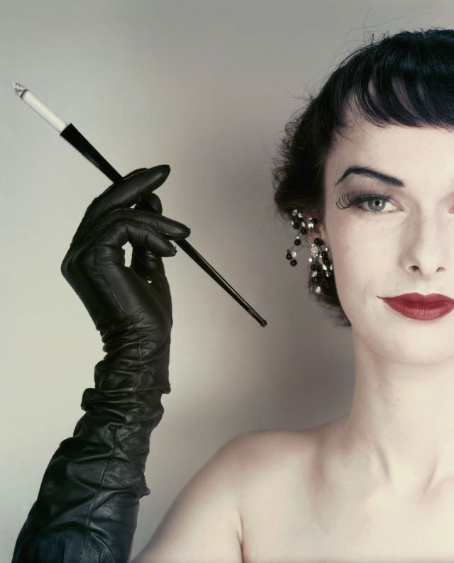 #3 Model Victoria von Hagen wearing jet and glitter earrings, full-length gloves by Super, 1952