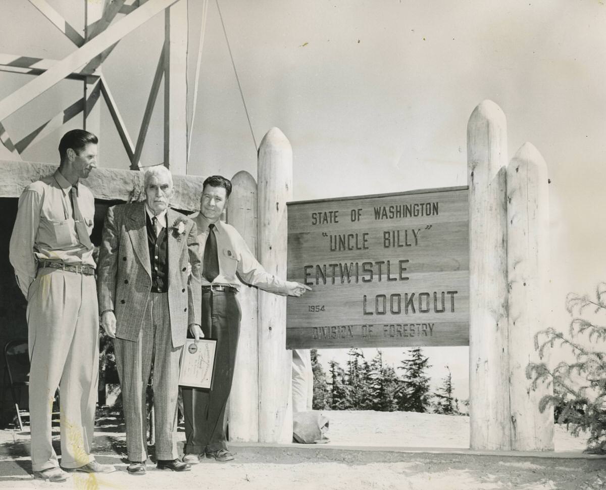 #126 G.S. Williams, William Entwistle, and L.T. Webster at Entwistle Lookout, 1954