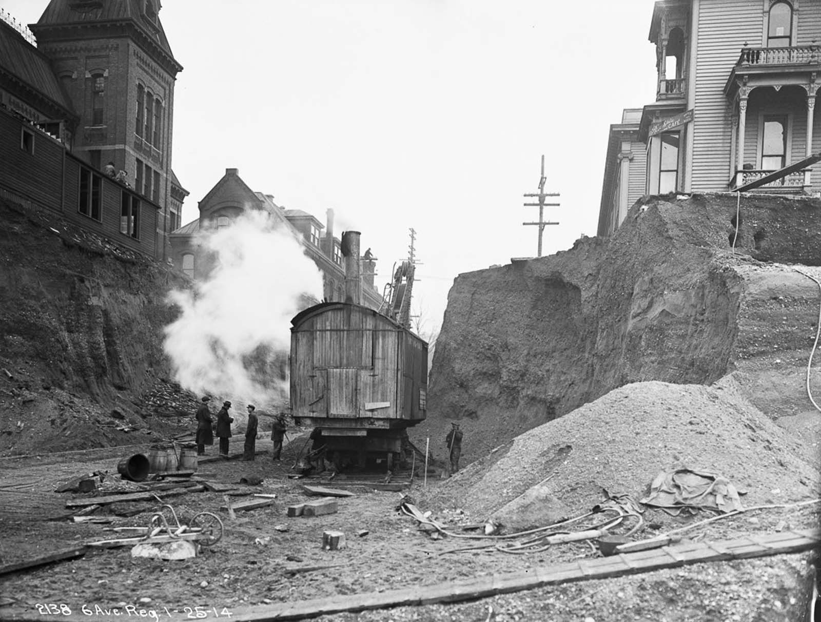 #16 A steam shovel digs on Marion Street during the Sixth Avenue regrade. 1914.