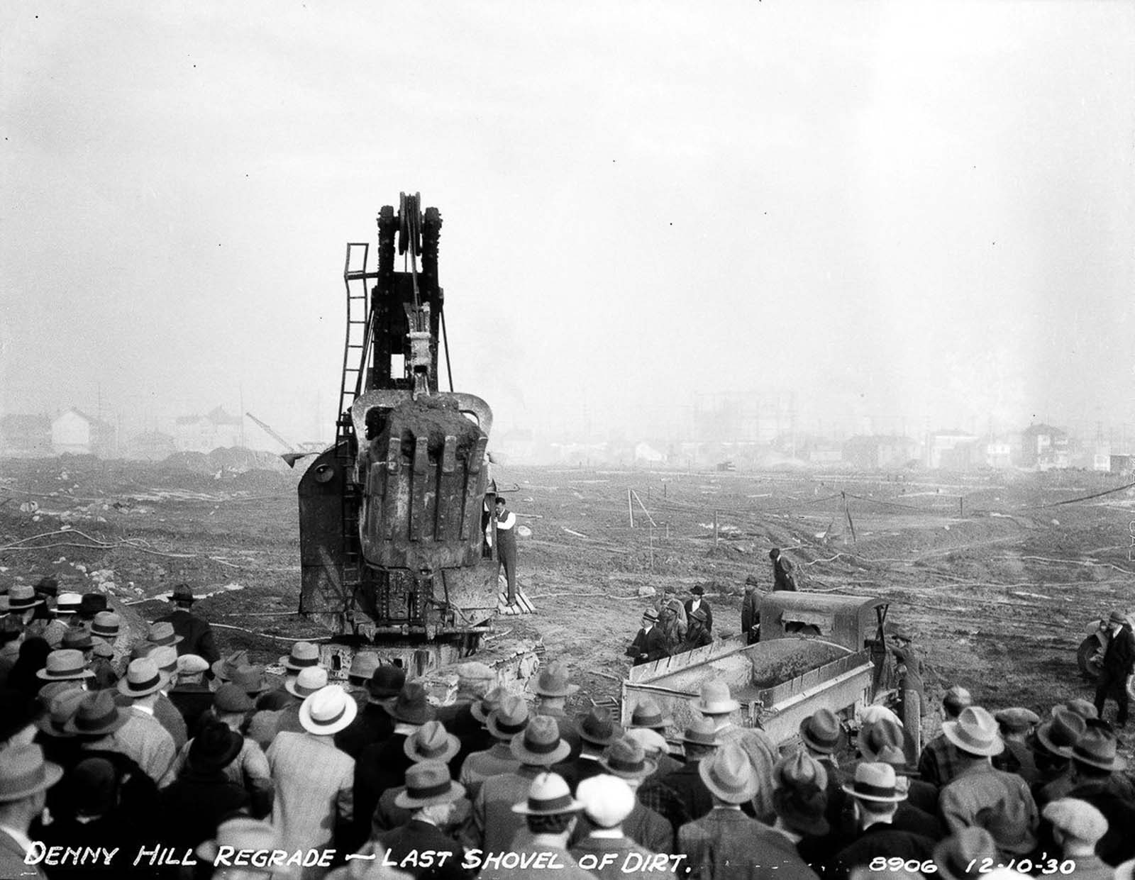 #18 A crowd gathers to witness the last shovel of dirt and the completion of the second Denny regrade.
