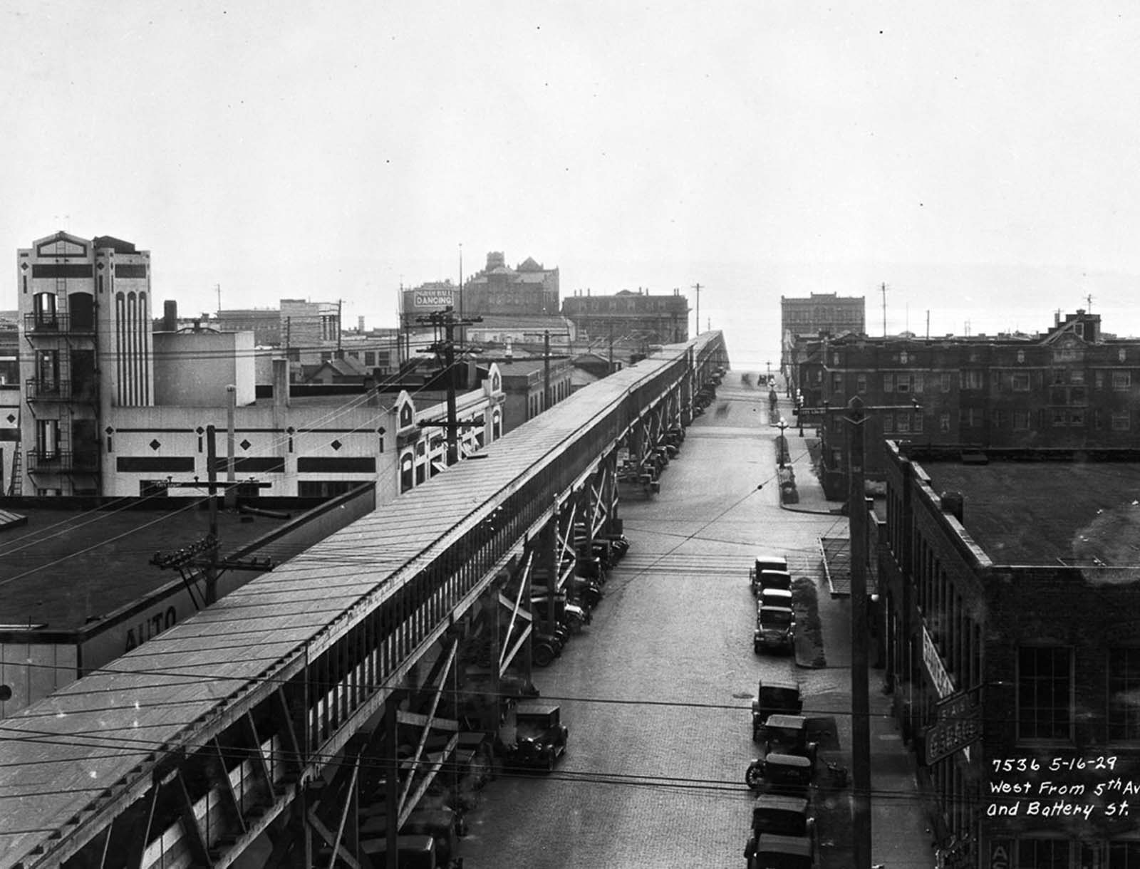 #20 A conveyor belt carries earth from the dig site down Battery Street to the harbor.