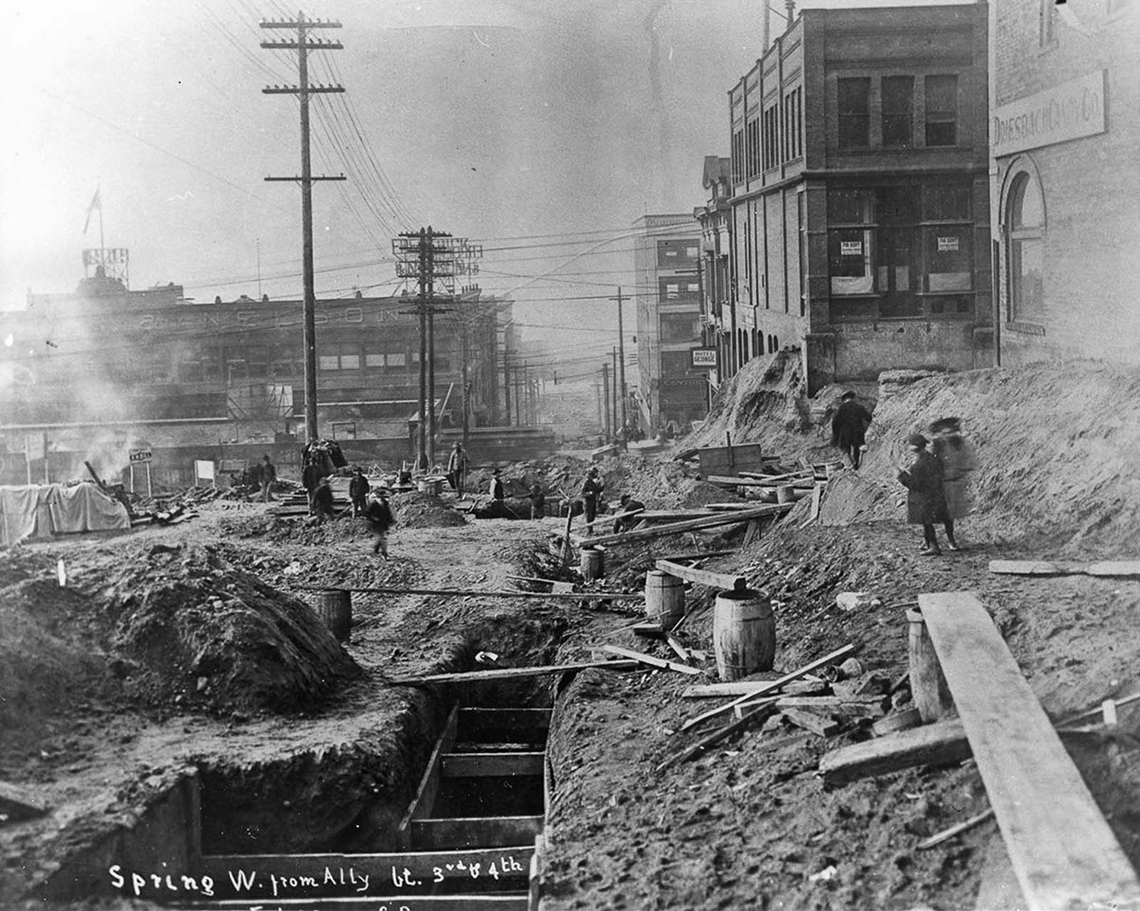 #5 Looking west down Spring Street during the first Denny regrade. 1907.