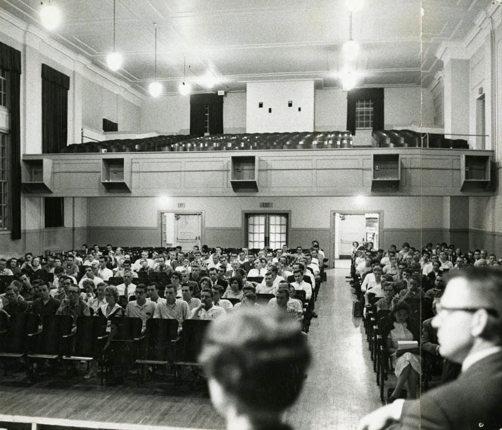 #29 The inside of old central high, in the auditorium full of students for graduation, 1980s