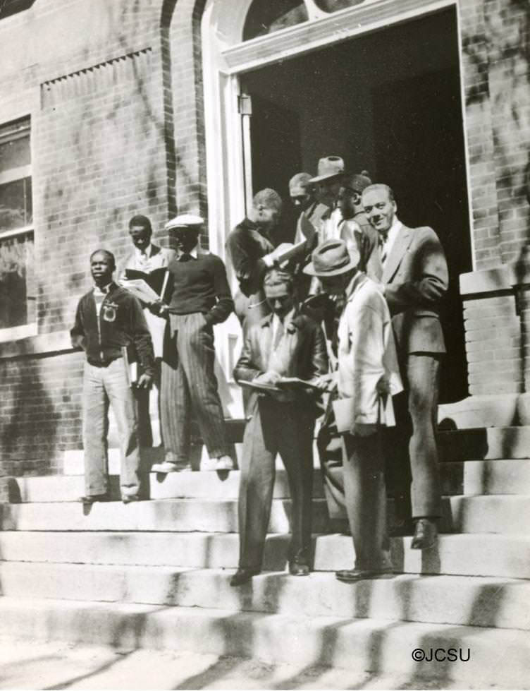 #16 Group of students on the steps of Biddle Hall, 1960s