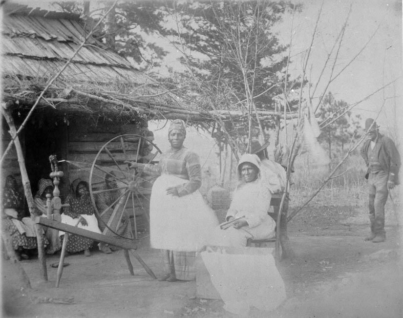 #38 Workers on a farm carding and spinning cotton, 1900
