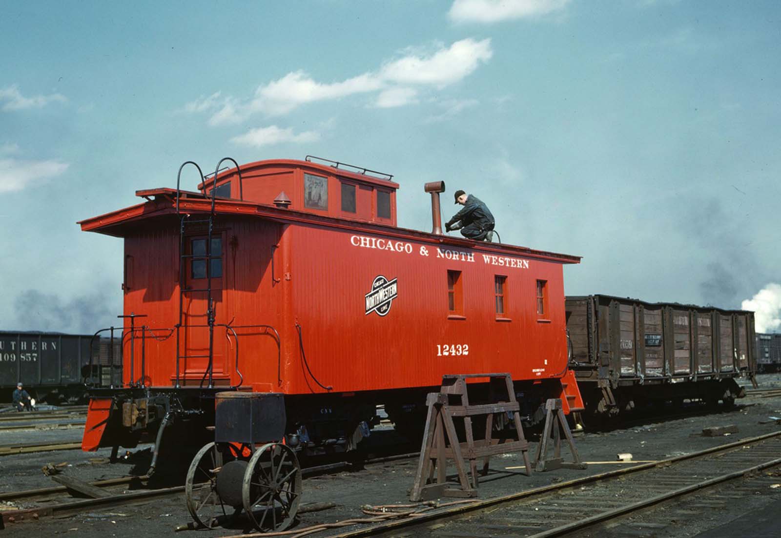 #20 Putting the finishing touches on a rebuilt Chicago and North Western Railroad caboose at the rip tracks in the Proviso yard in Chicago in April 1943.