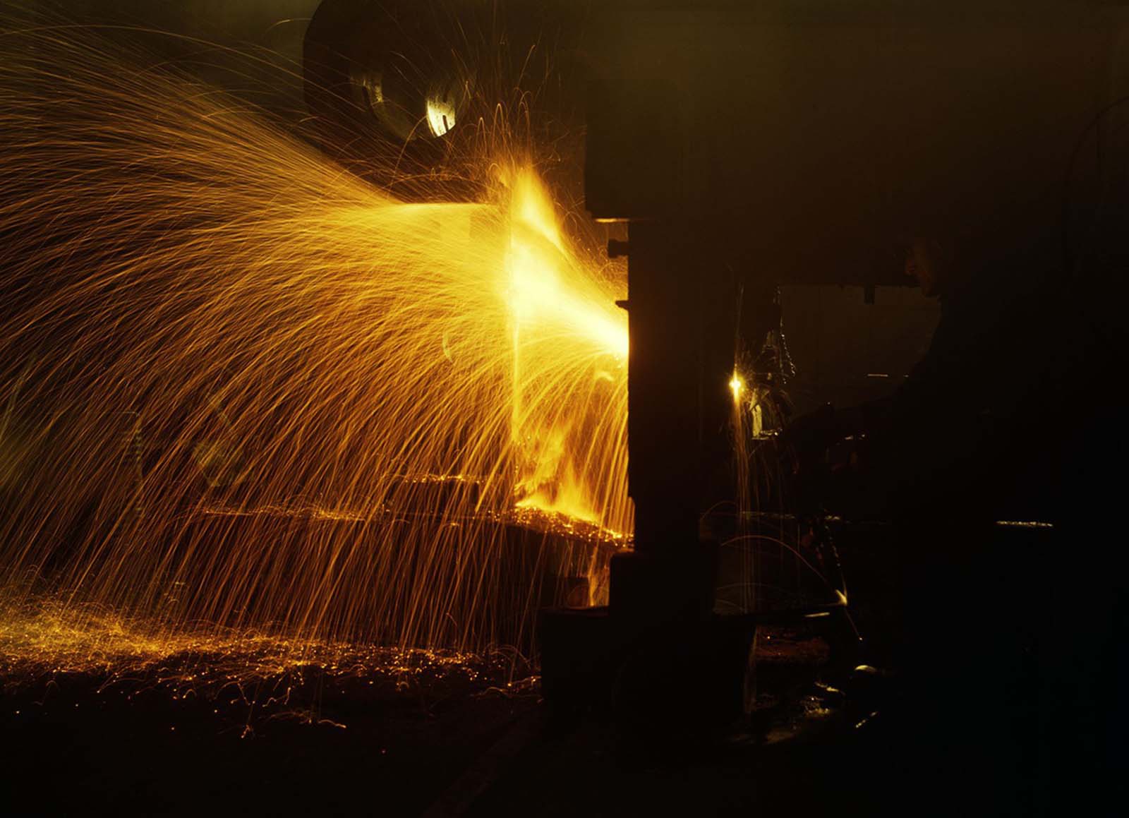 #8 A welder works in the roundhouse of the Chicago and North Western Railroad’s Proviso yard in December 1942.