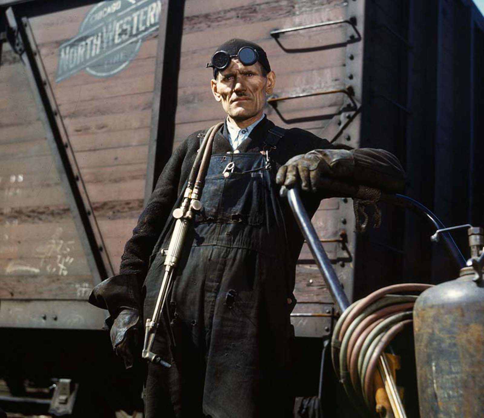 #9 Mike Evans, a welder, at the rip tracks at the Proviso yard, photographed in April 1943.