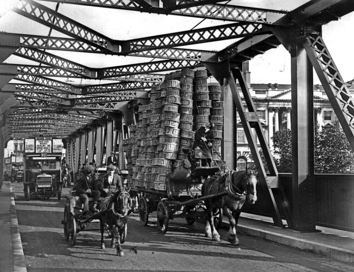 #4 A Covent Garden carman crossing a temporary Waterloo Bridge, London, 1925.