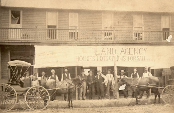 #140 Land agency on the corner of Lancaster and Main Street, 1880