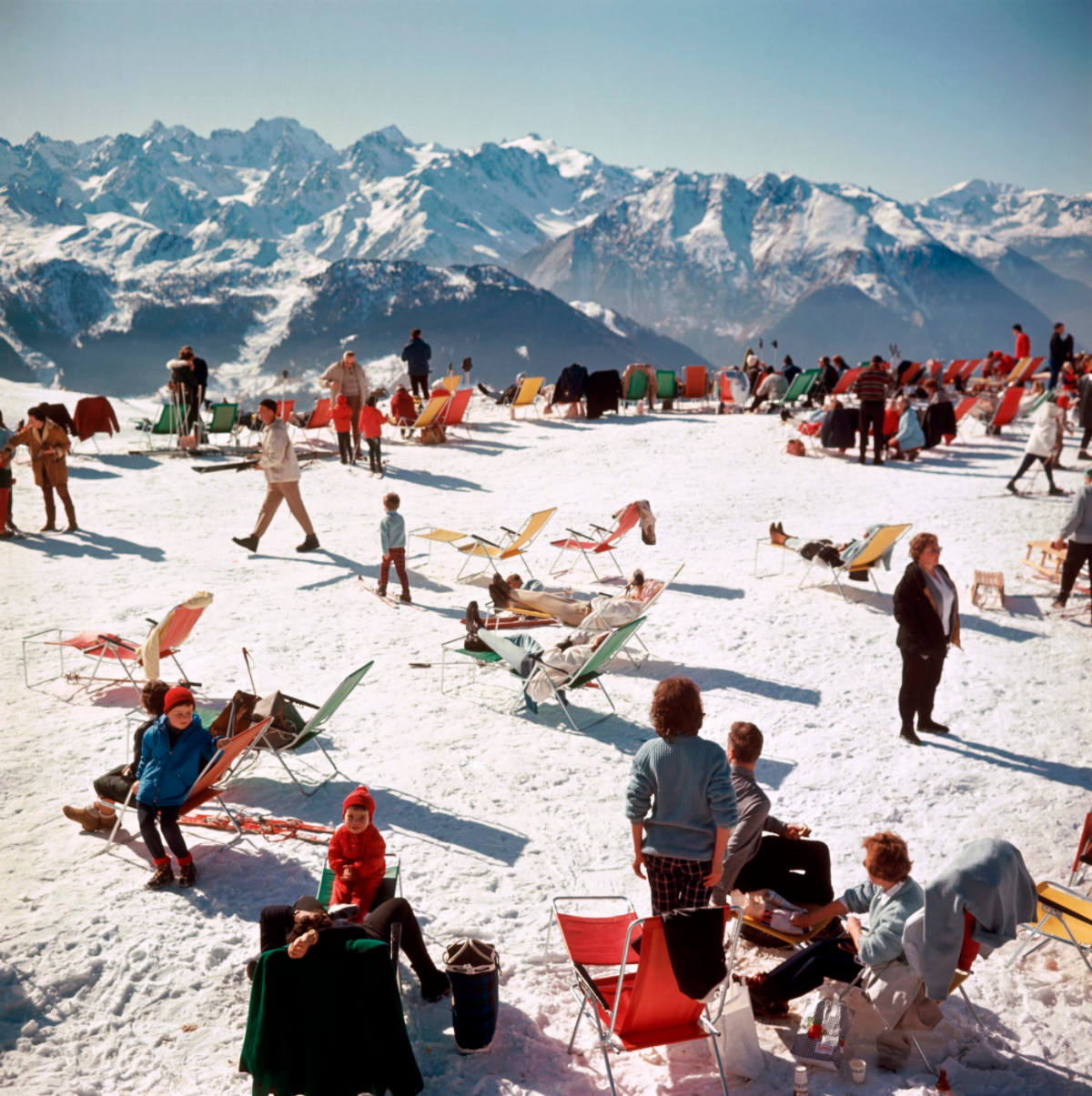 #3 Holiday-makers take the sun on a mountain top in Verbier, 1964.
