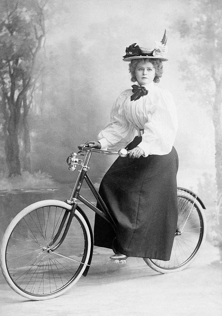 #10 Mabel Love on a bicycle, posing for a photograph, 1905.