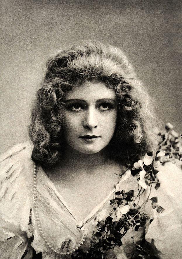 #13 Mabel Love, featured on a vintage card, 1900.