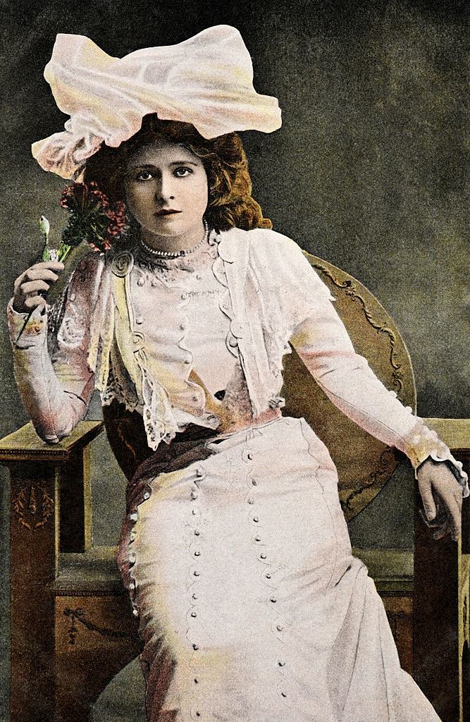 #6 Mabel Love holding a flower, 1910.