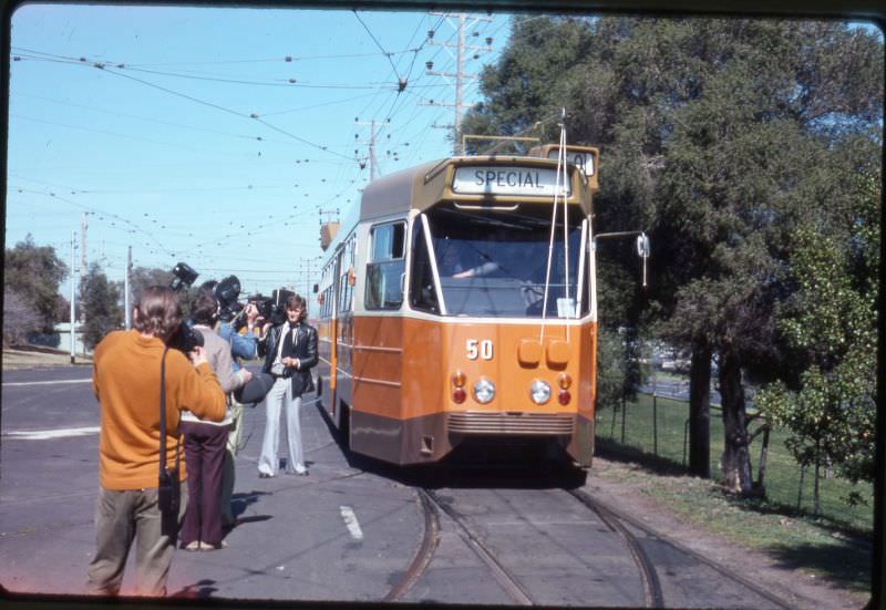 #39 News reporters beside the no.50 tram, Melbourne, circa 1970s