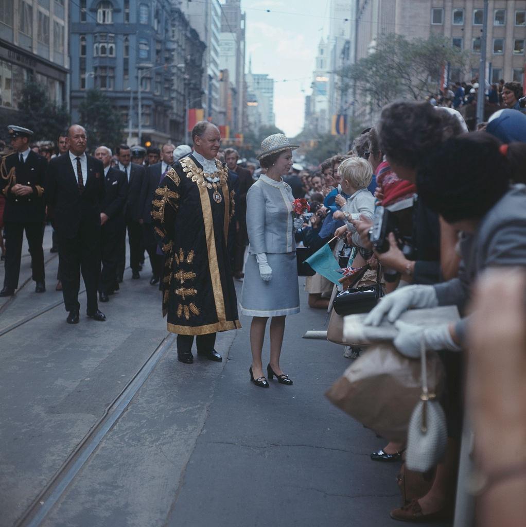 #55 Queen Elizabeth II on a walkabout in Melbourne with Ted Best (1917 – 1992), Lord Mayor of Melbourne, during her tour of Australia, 6th April 1970.