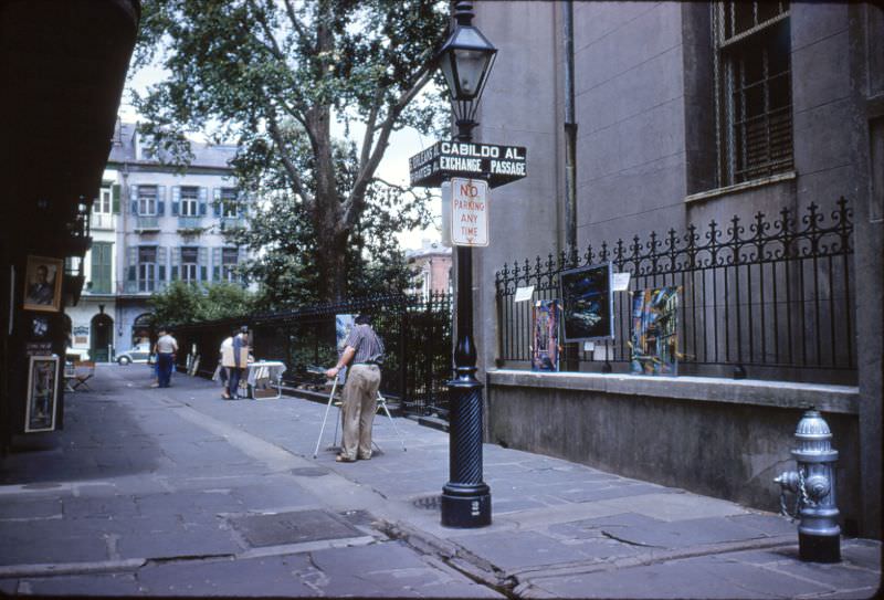 #106 Pirate’s Alley with painter, New Orleans, 1956.