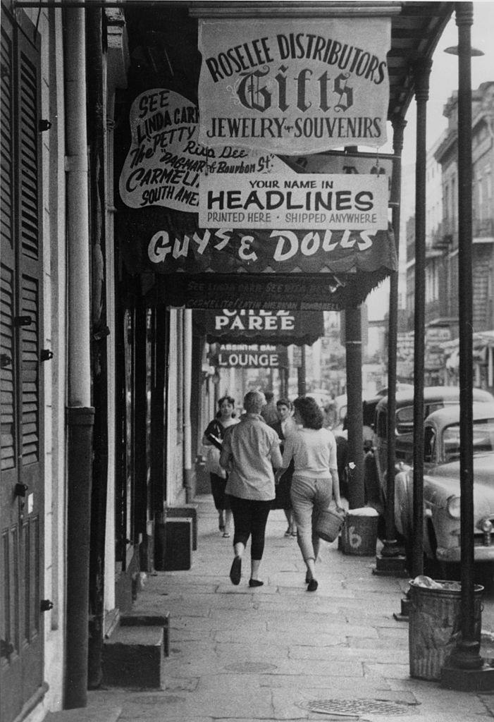 #13 Two women walking along a pavement on Bourbon Street, New Orleans, 1955