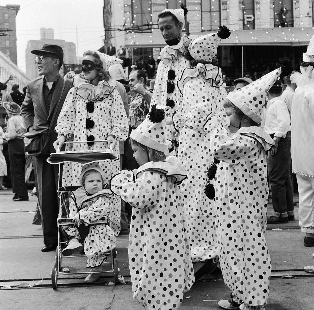 #61 A family in fancy dress dressed identically as clowns at the Mardi Gras, in New Orleans, 1956