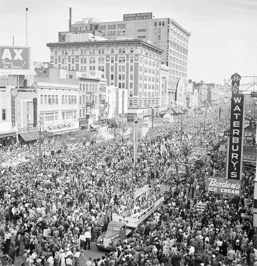 #64 Crowds throng a major street in New Orleans for a Mardi Gras parade, New Orleans, 1950