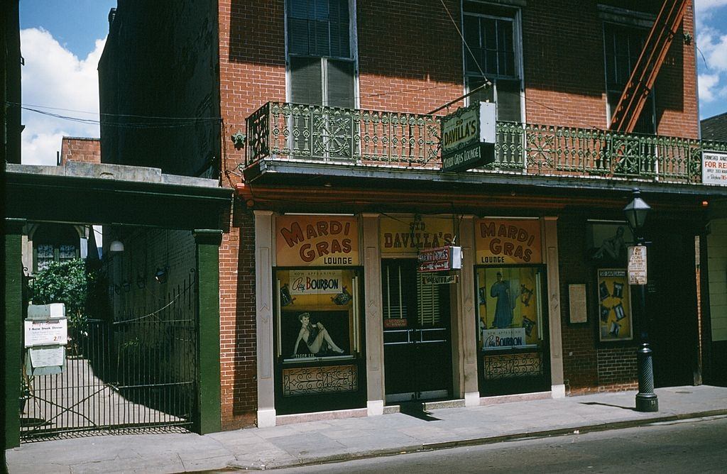 #73 A view down Bourbon street outside Sid Davillas Mardi Gras Longe in New Orleans, 1957.