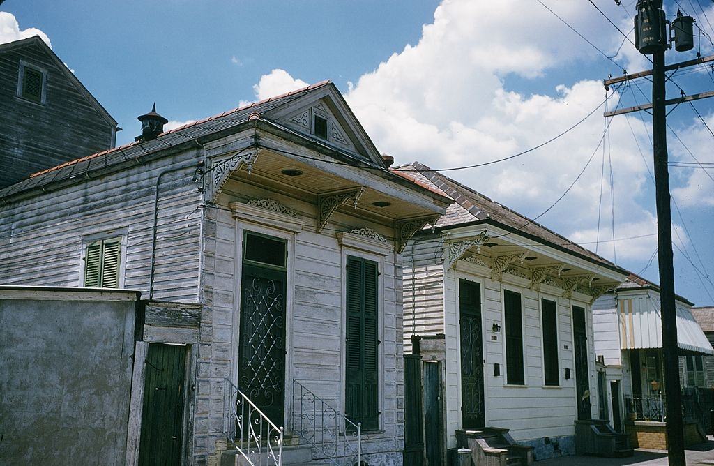 #56 A street view of boarded up homes in New Orleans, 1957.