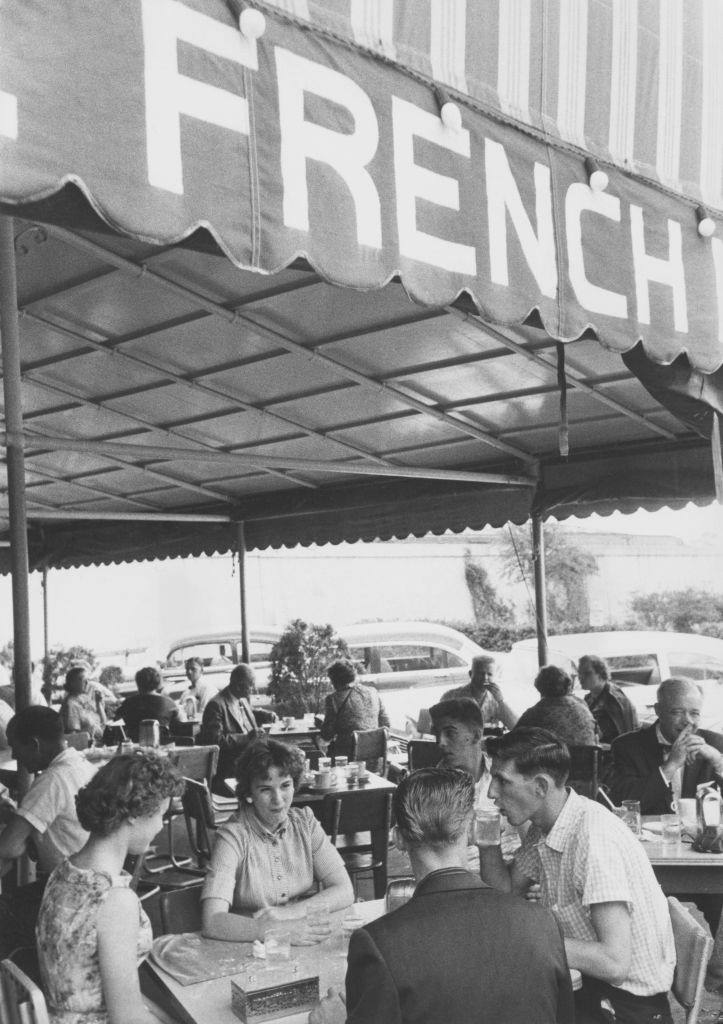 #8 Patrons at the Cafe du Monde, an open-air coffee shop in the French Market, Decatur Street, New Orleans, 1950