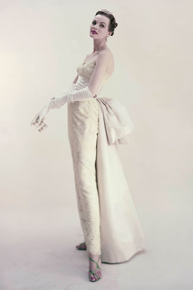 #1 Model wearing a yellow lace creamy satin gown by Harvey Berin and Karen Stark, 1952