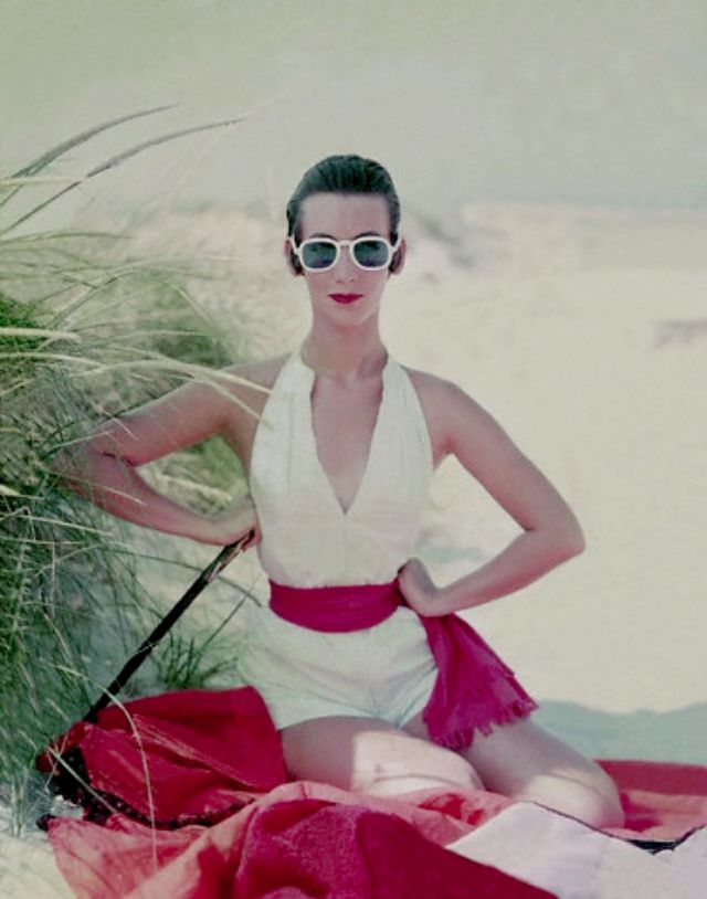 #12 Ruth Neuman Derujinsky wearing a white cotton halter top, shorts and a cotton poplin lavender sash, 1953