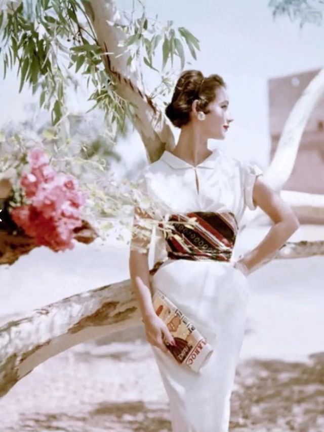 #8 Model wearing a dress of cotton challis, wrapped waist by Samuel Winston, 1953