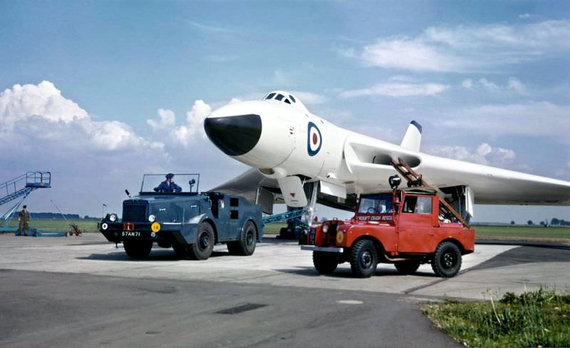 #3 Avro Vulcan B.1 XA906 of No. 83 Squadron is seen under-tow by a Douglas Sentinal Tugmaster heavy towing unit at RAF Waddington, October 1957