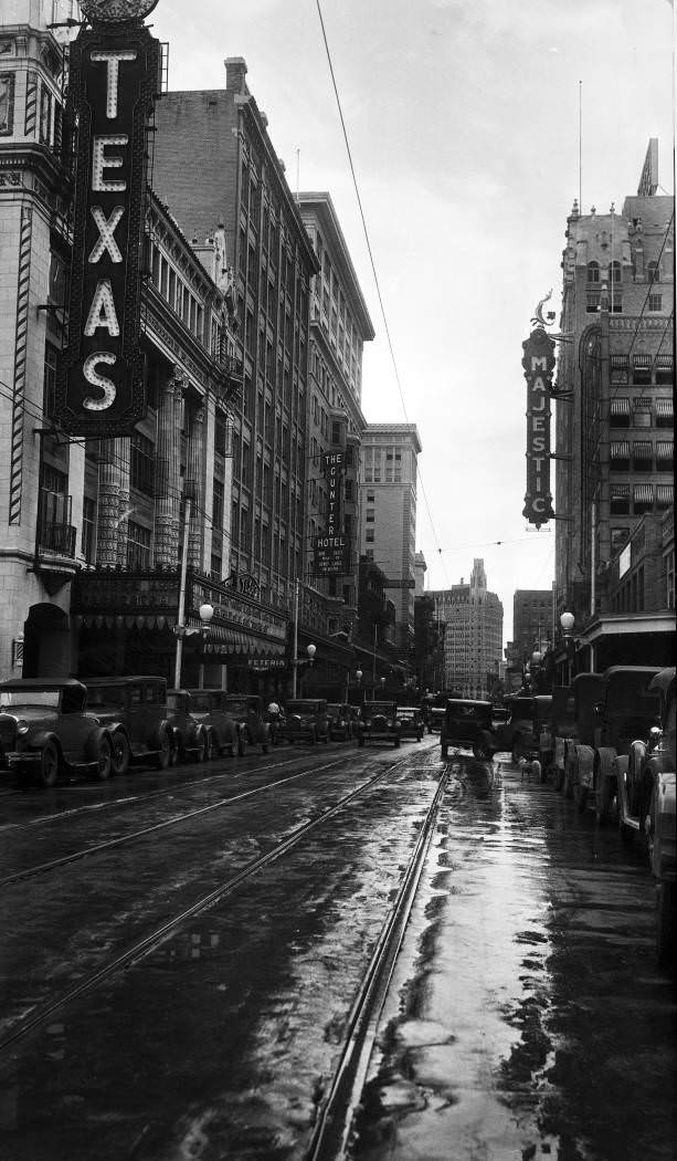 #170 Houston Street looking east from San Antonio River bridge following rain shower, San Antonio, 1929