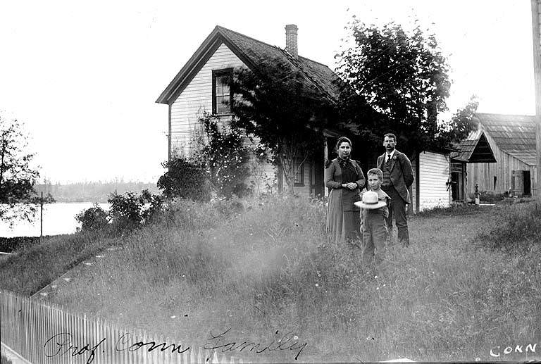 #137 George Conn, wife, and son Neil standing outside Judge William D. Wood house, 1897