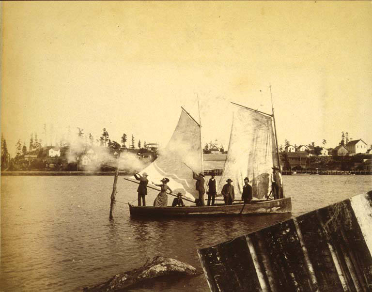 #38 Men and women in a sailboat shooting guns, 1889