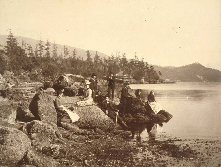 #8 Men and women on an outing on the beach, possibly south of Alki Point, Seattle, 1889.