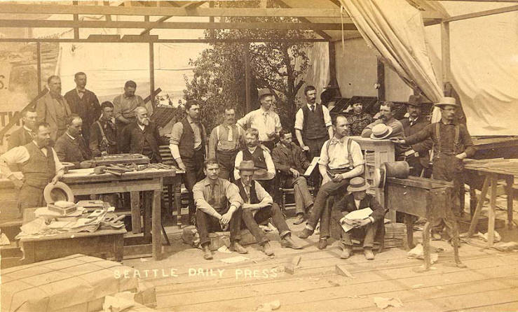 #49 Seattle Daily Press newspaper staff and equipment housed in temporary tent after the fire of June 6, 1889, Seattle.