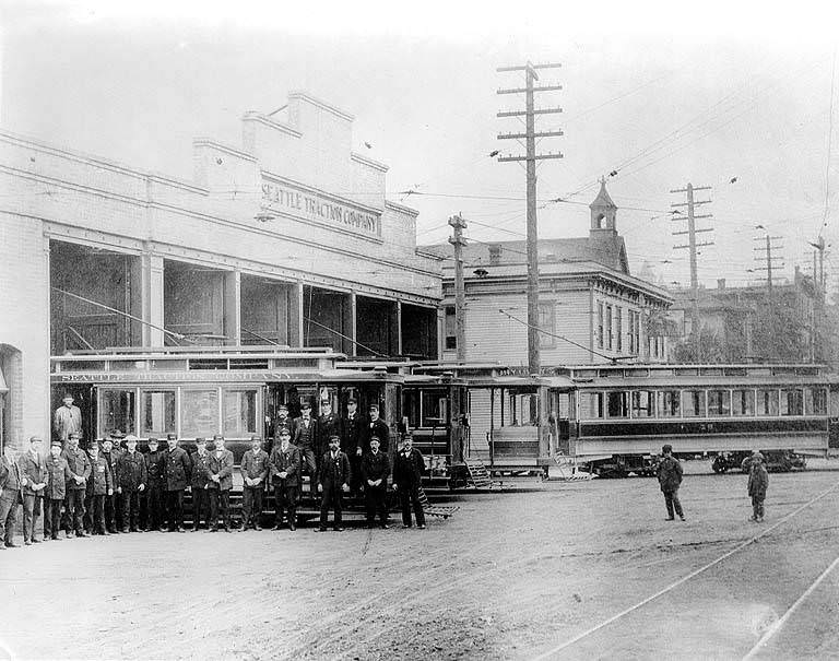 #166 Seattle Traction Company car barn at 5th Ave. and Olive St. showing staff and streetcars, 1898