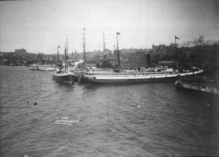 #167 Ships at dock on the waterfront near Pier A at the foot of Washington Street, Seattle, 1897.