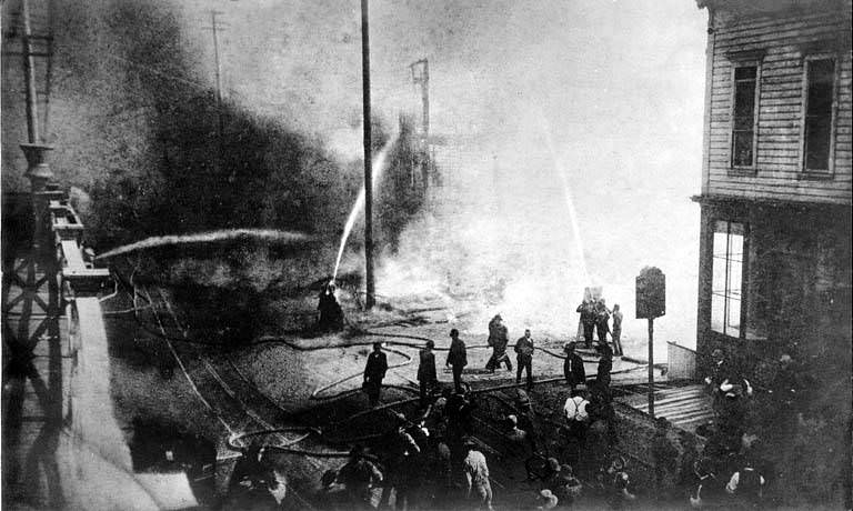 #61 Start of the fire of June 6, 1889, looking south on 1st Ave. near Madison St.