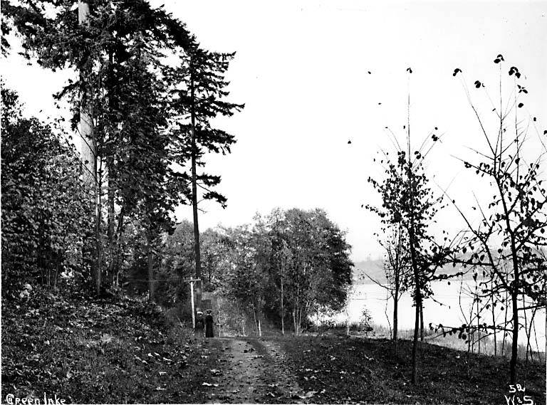 #178 Two women walking in Woodland Park near Green Lake, 1897