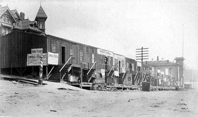 #24 Businesses in temporary buildings on 3rd Ave., looking south from James Street, aftermath of the Seattle Fire of June 6, 1889