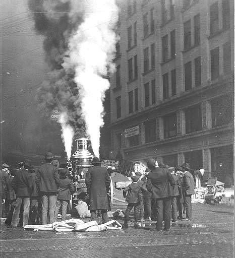 #47 Crowd with hose cart at scene of fire, 1895