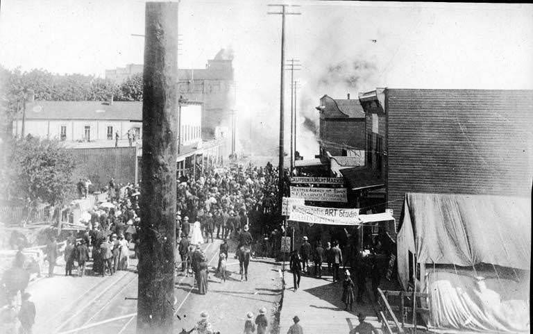 #29 Fire of June 6, 1889 looking south along 1st Ave. from Spring St. showing the beginning of the fire