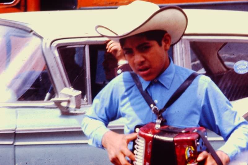 #16 Young man getting ready for a performance with his accordian, Tijuana, 1971