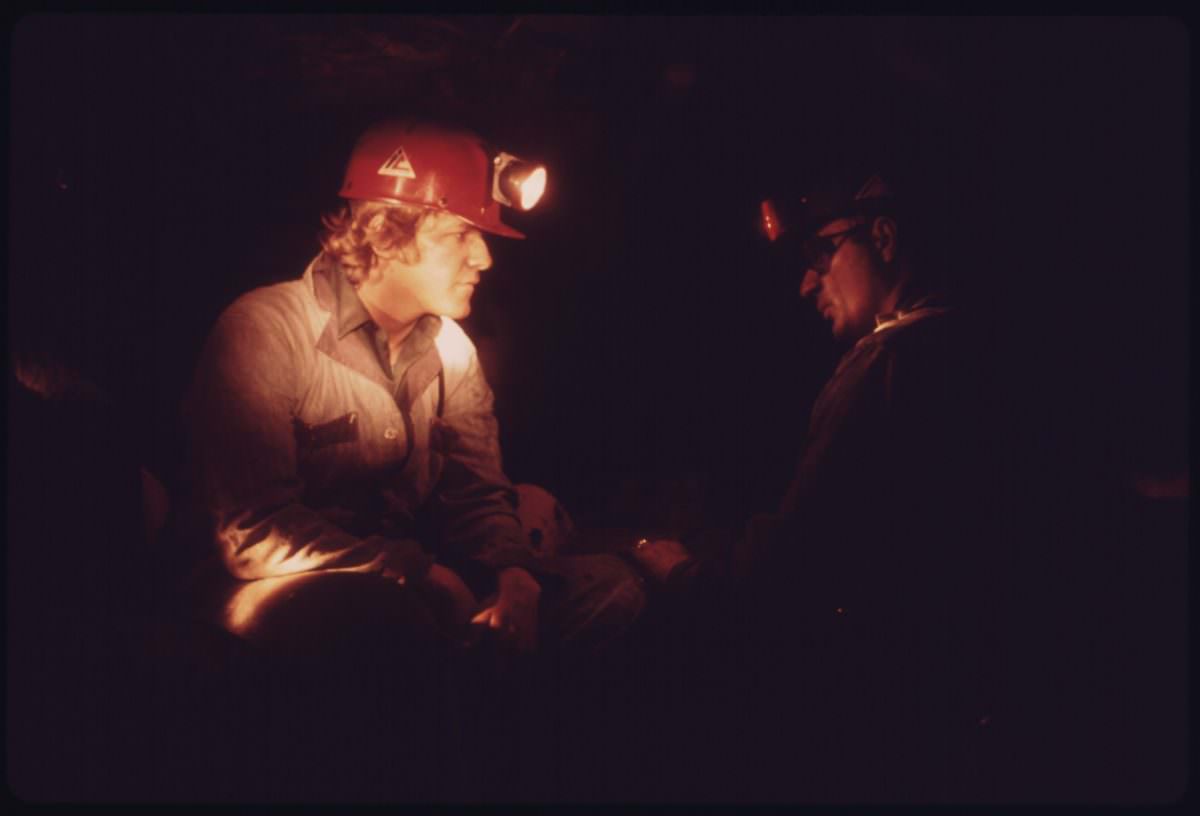 #16 Veteran miner Harold Stanley, right, talks to a young miner who has come into the mine for the first time after 40 hours of classroom training.