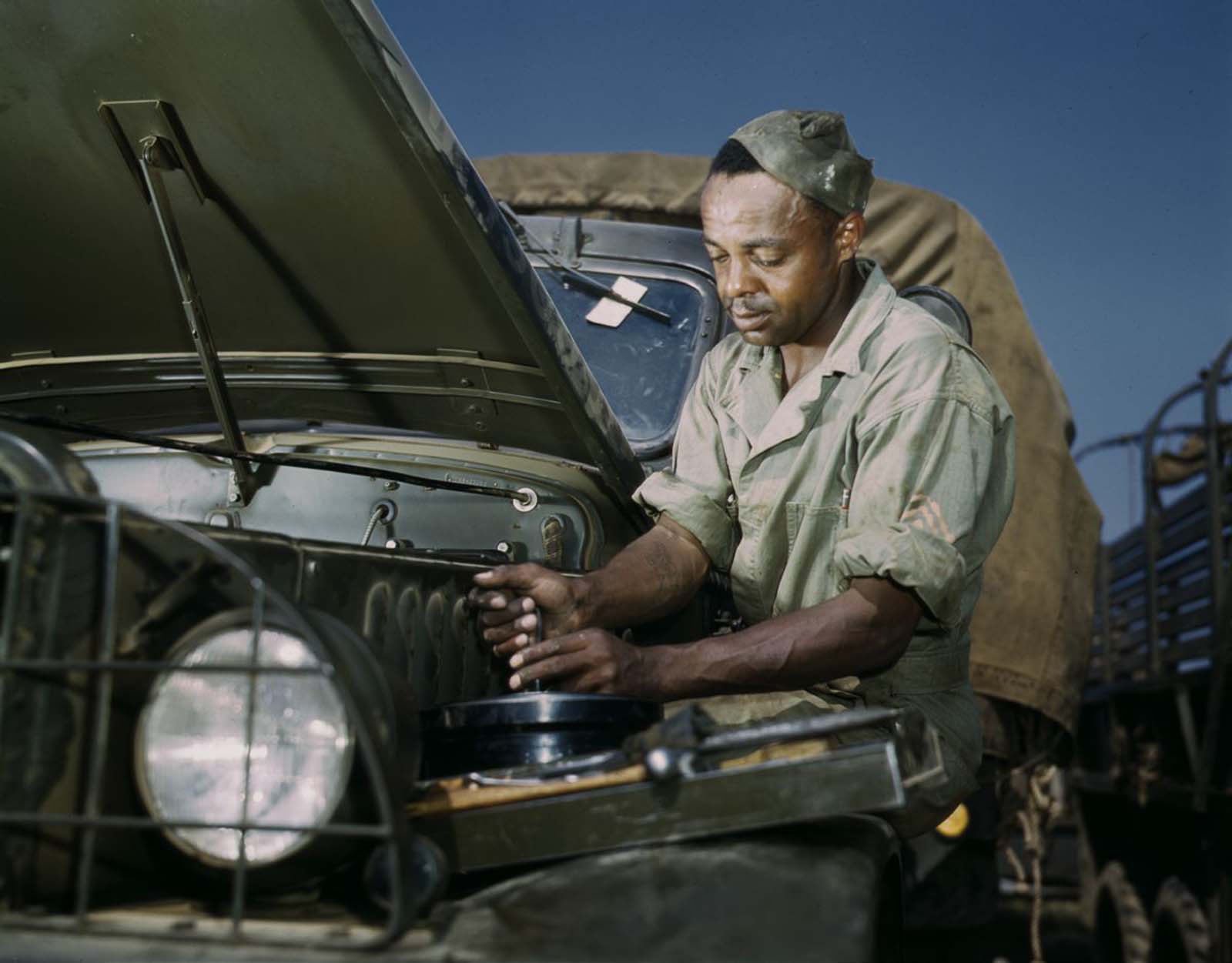 #15 A mechanic works on a troop transport vehicle.